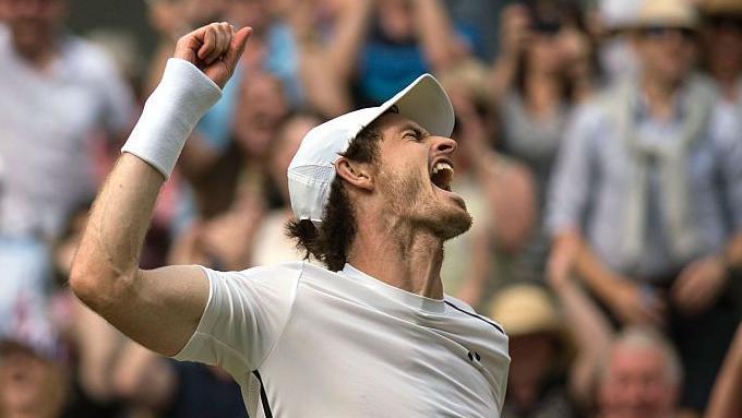 Andy Murray roars and pumps his fist in celebration
