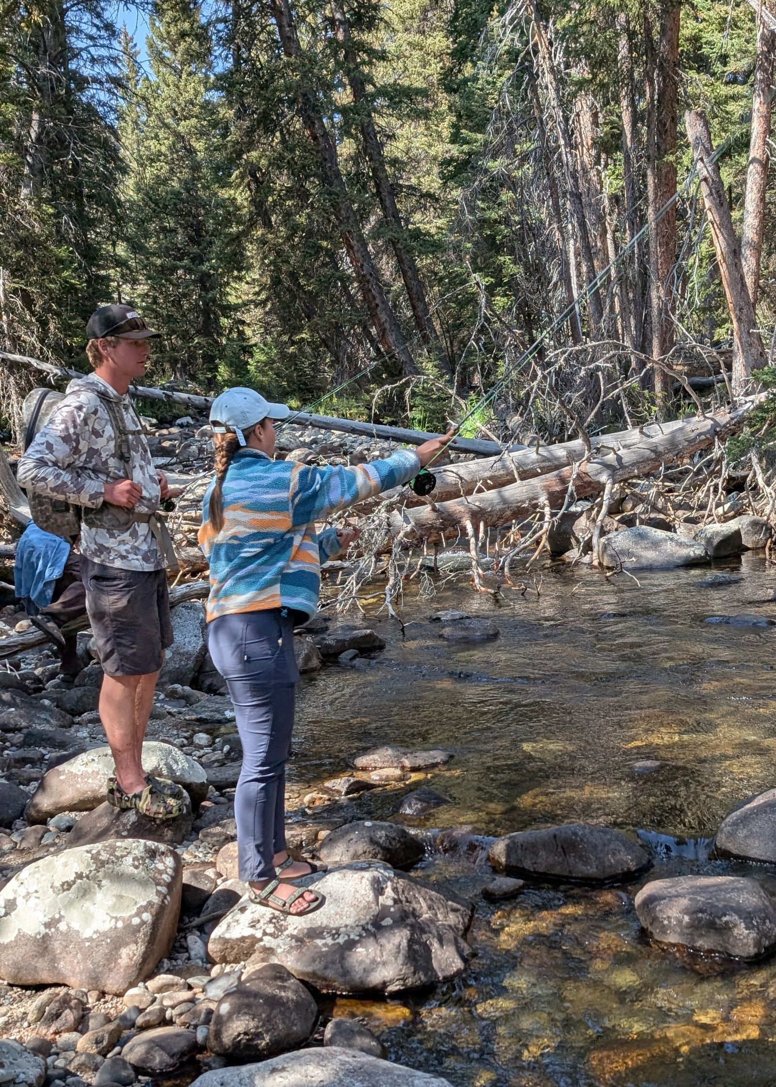Image may contain Nature Outdoors Wilderness Rock Fishing Leisure Activities Water Plant Vegetation and Clothing