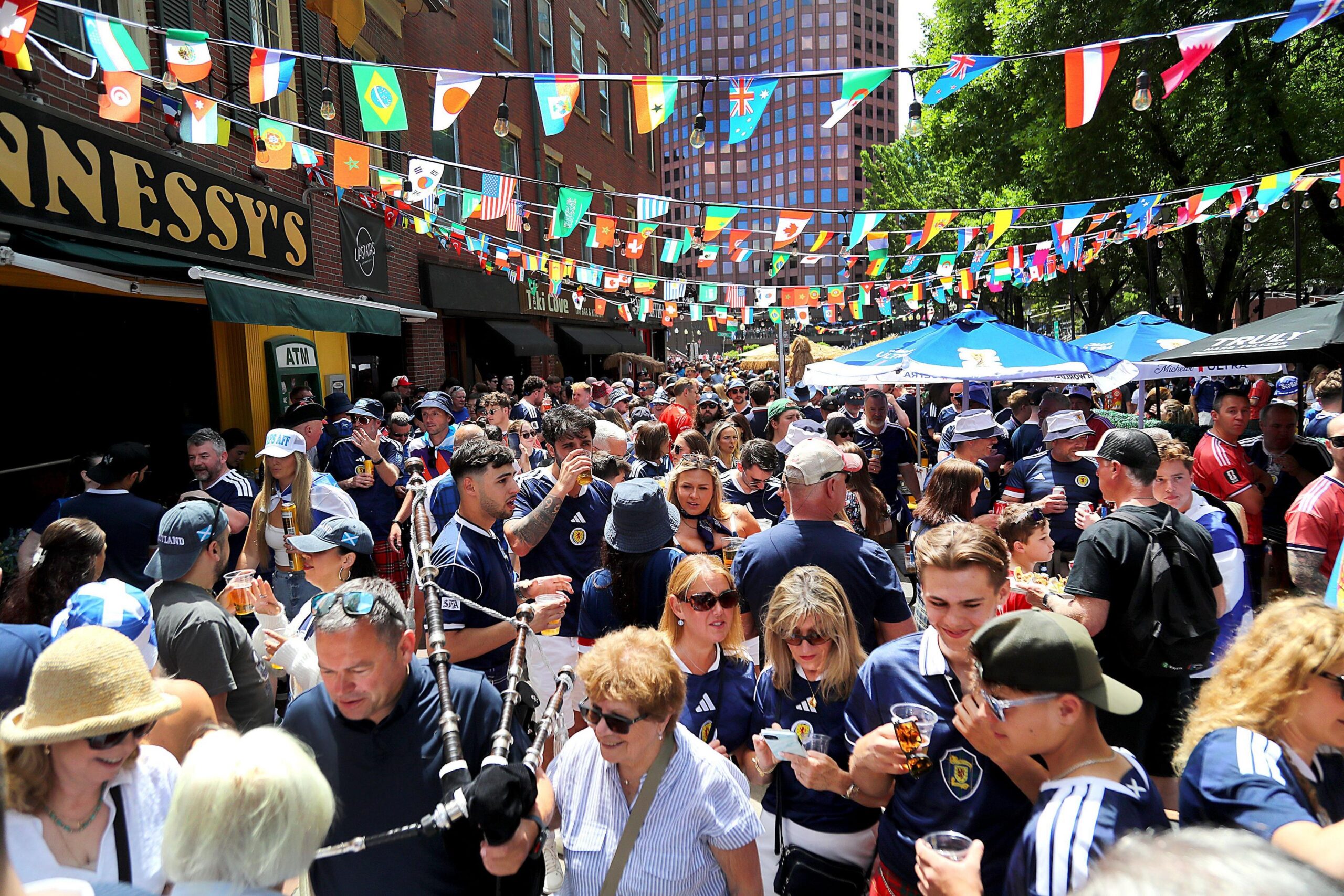 Scotland football fans congregate outside of Hennessy's Bar in Boston on the day of the Morocco match