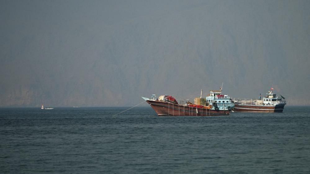 Smaller vessels anchored in the Strait of Hormuz.