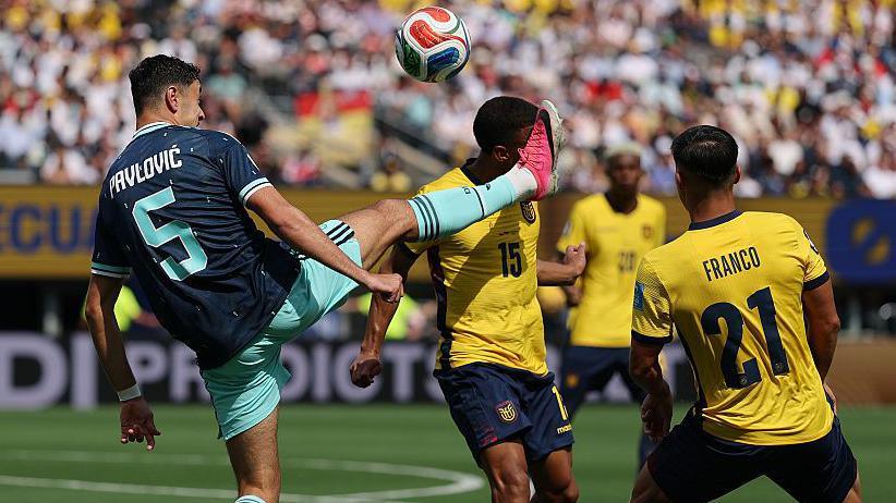Germany's Aleksandar Pavlovic catches Ecuador's Pedro Vite with a high boot
