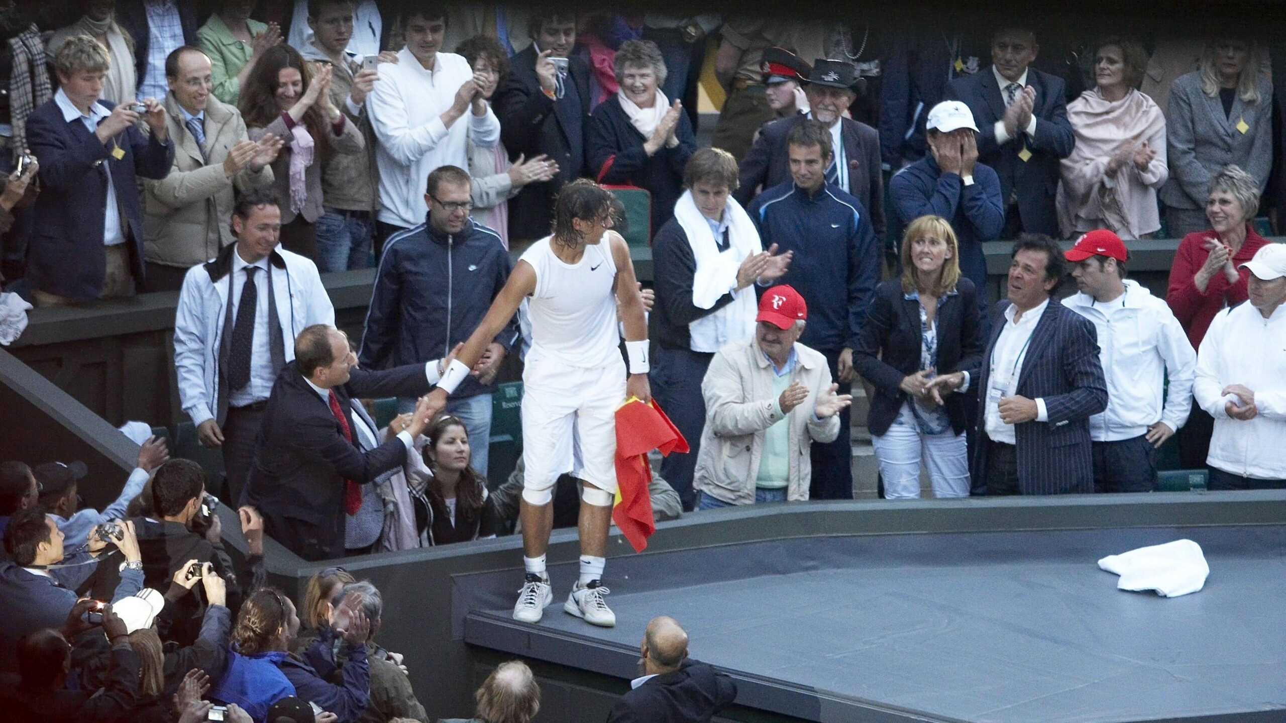 Rafael Nadal climbs into the stands on Centre Court after winning Wimbledon in 2008