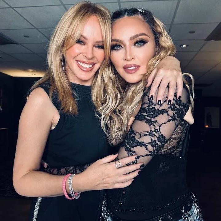 Kylie and Madonna pose backstage at the star's Celebration tour