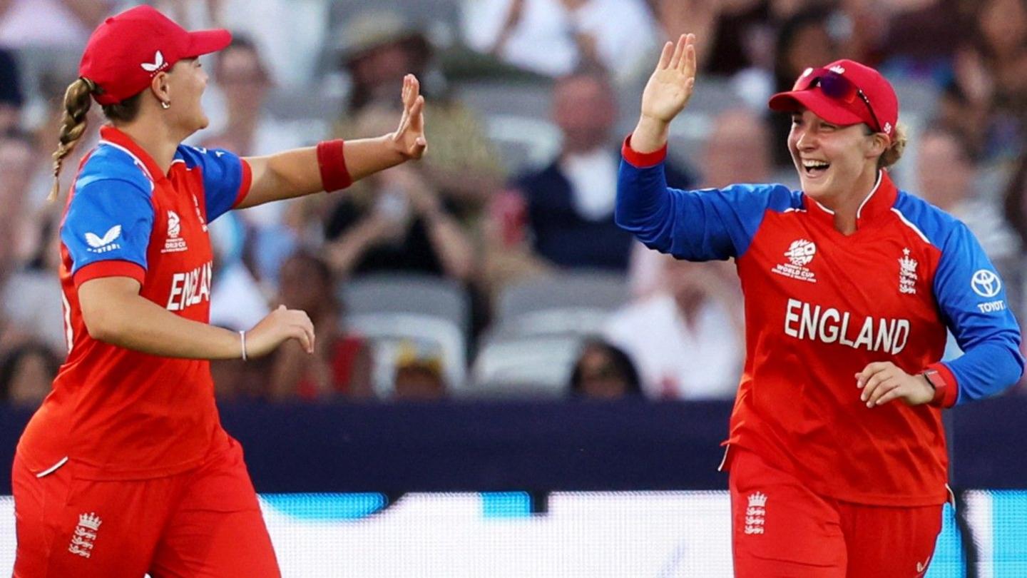 Dani Gibson and Alice Capsey celebrate a wicket with a high five