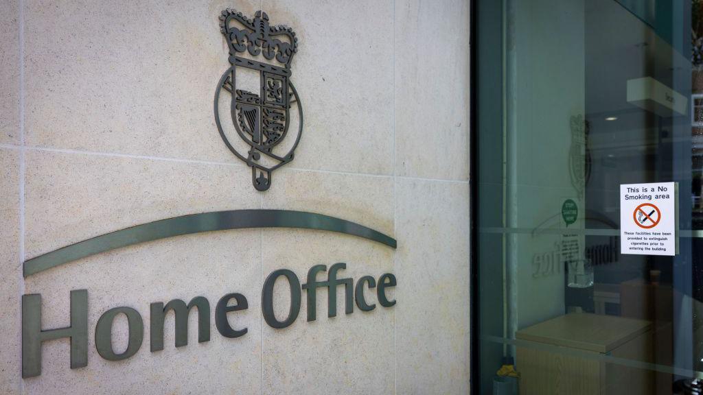 The Home Office logo on the exterior of a Home Office building