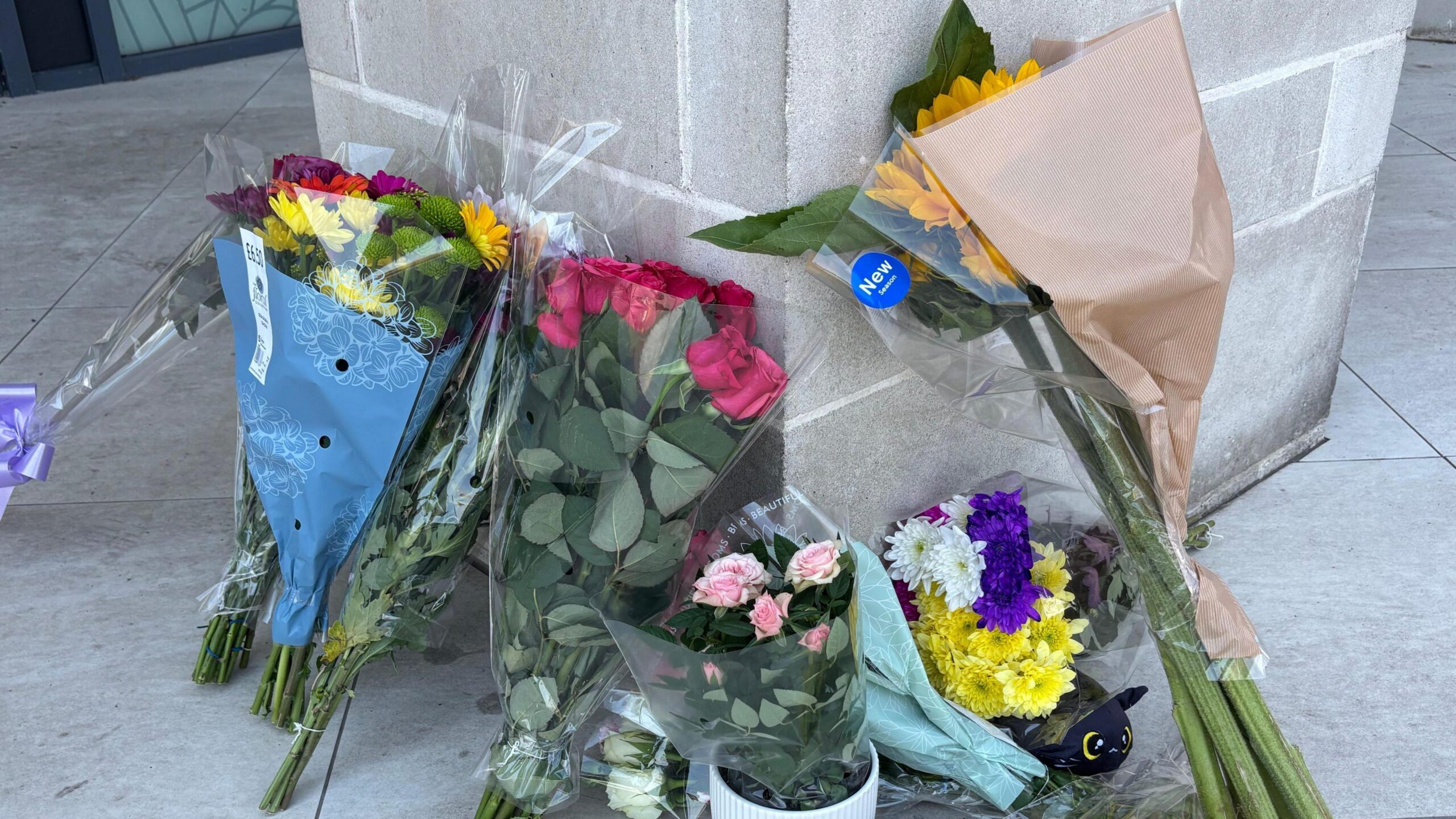 Flowers left at the entrance to a flat.