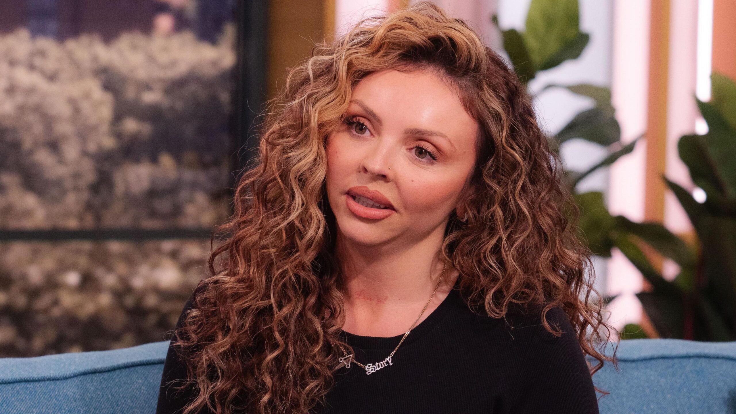 Jesy Nelson sitting on the sofa on ITV's This Morning