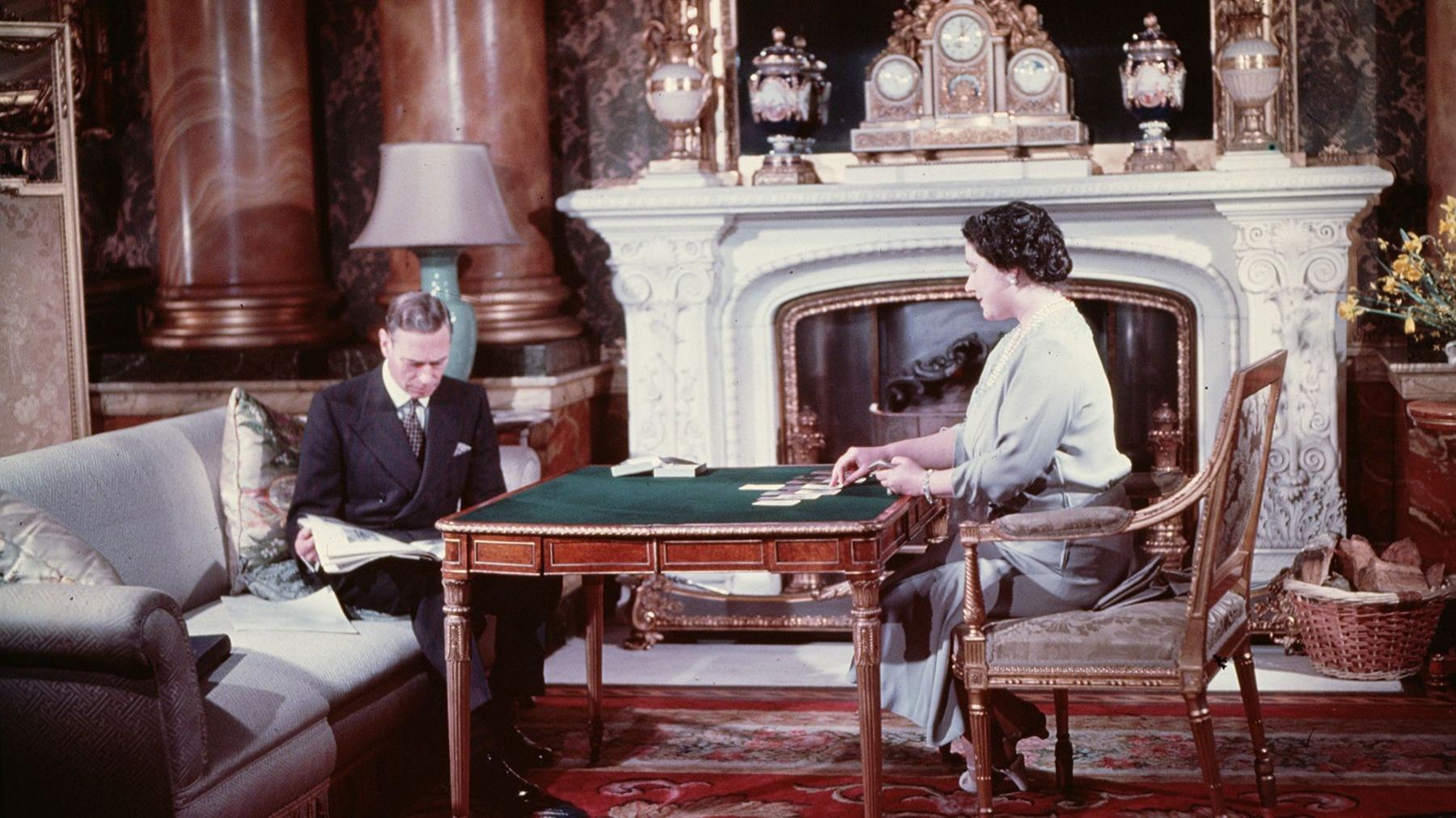 King George VI and Queen Elizabeth entertain themselves during a quiet moment at Buckingham Palace, London, in 1942