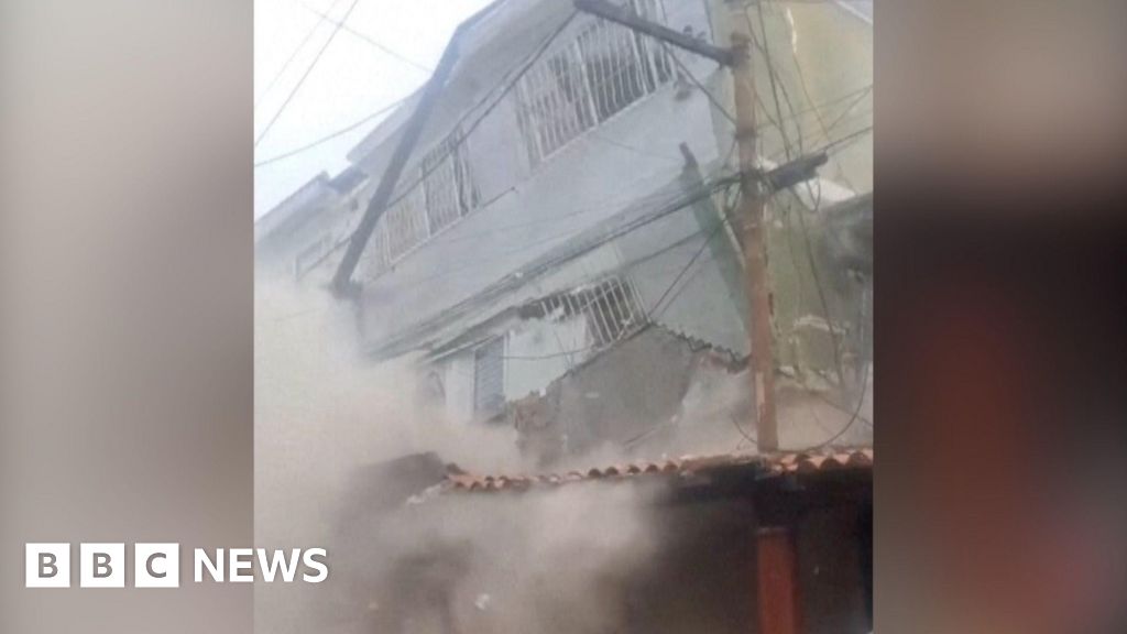 People flee as building collapses on Caracas outskirts People flee as building collapses on Caracas outskirts