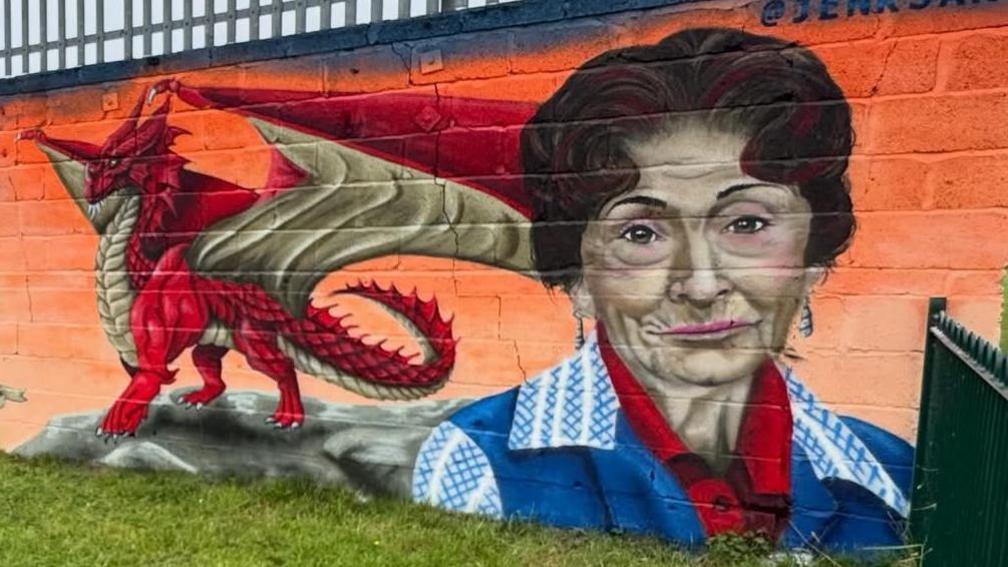 Murals of a dragon and Dot Cotton