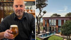 Barman raises a glass after £3.5m Omaze house win Barman raises a glass after £3.5m Omaze house win