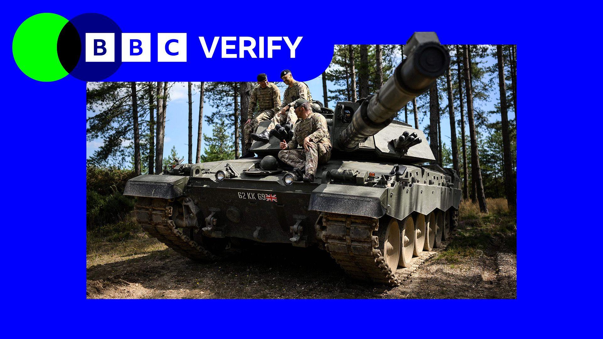 Three soldiers sitting on top of a tank. The BBC Verify logo appears in the top left corner.