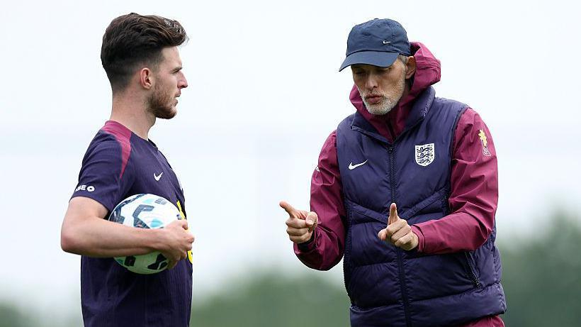 Declan Rice and Thomas Tuchel talking in England training