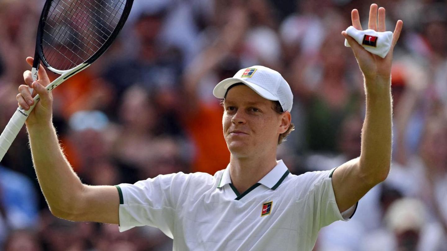 Jannik Sinner celebrates coming through his first-round match against Miomir Kecmanovic