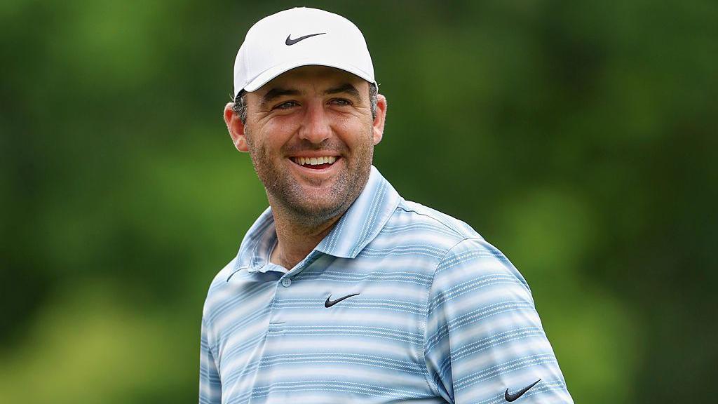 Scottie Scheffler smiles during the second round of the Travelers Championship in 2026