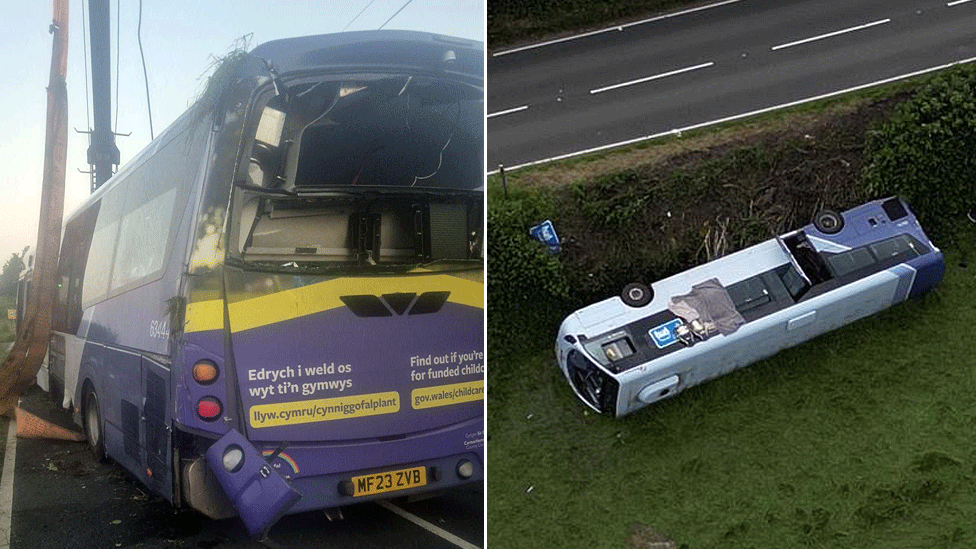 A purple bus, on the left upright and on the right on its side