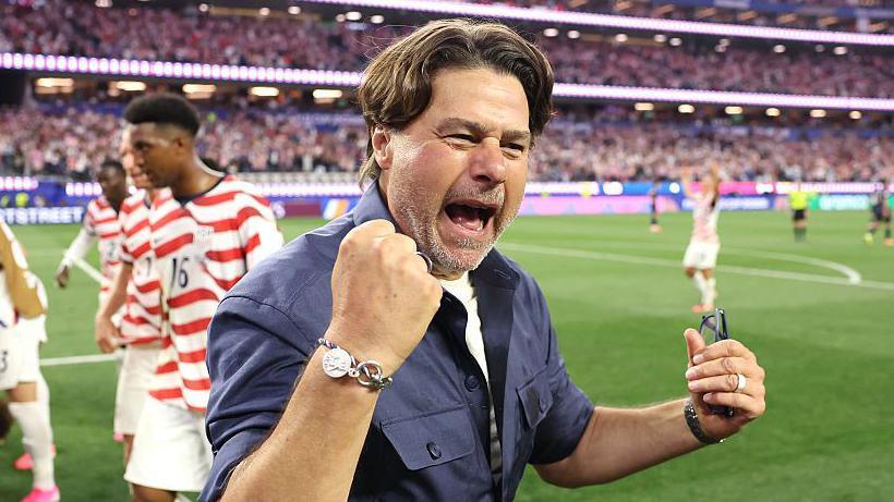 Mauricio Pochettino celebrates the USA's win against Paraguay