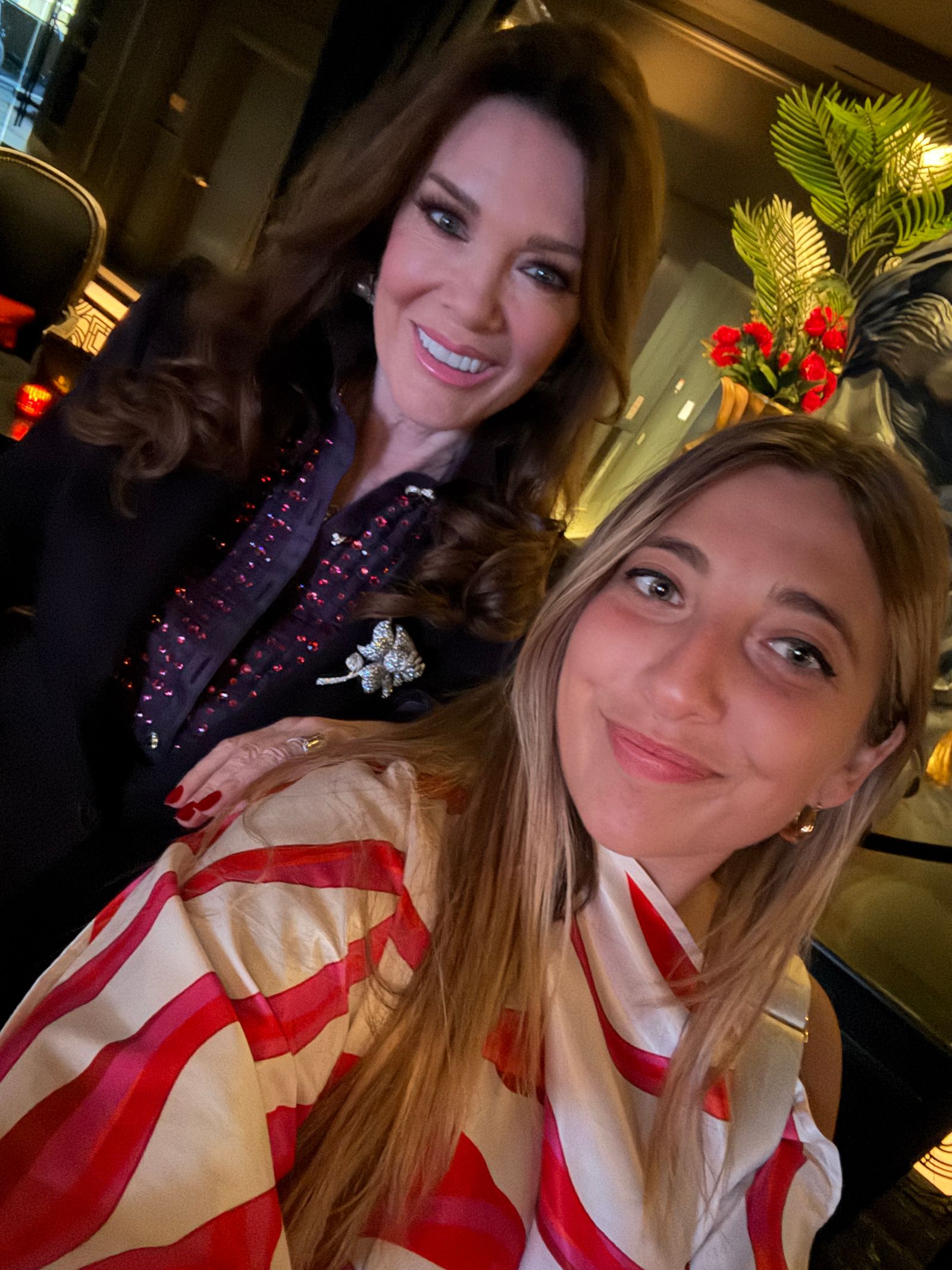 Image may contain Denise Richards Face Head Person Photography Portrait Blouse Clothing Plant and Potted Plant