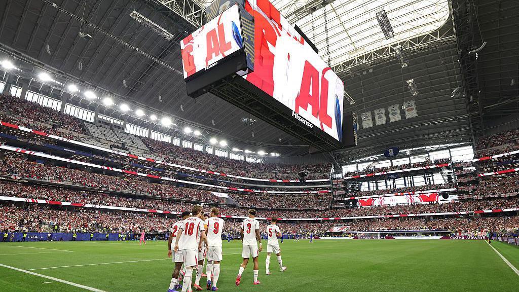 England players on the pitch at Dallas Stadium