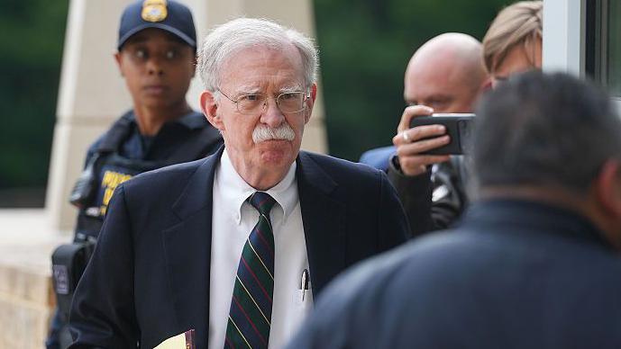 John Bolton arrives in court on Friday