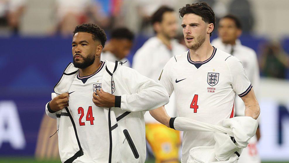 Reece James and Declan Rice taking off tracksuits