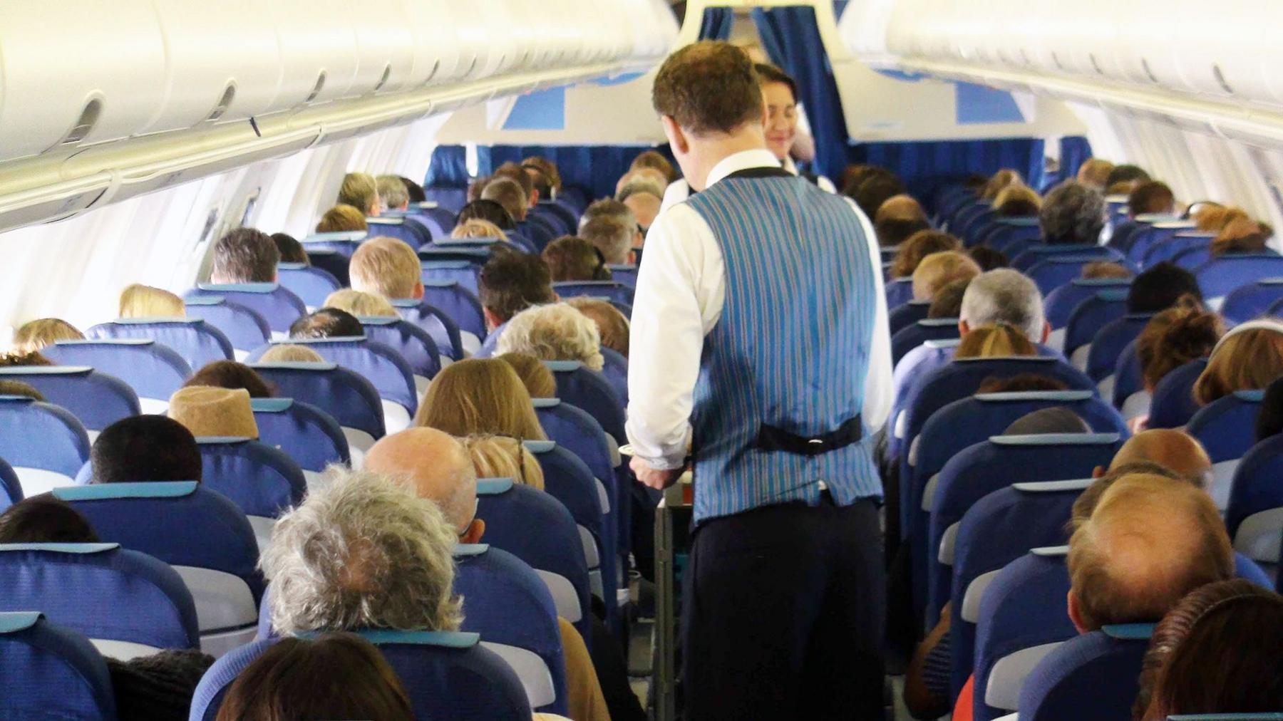 Passengers and cabin crew in plane