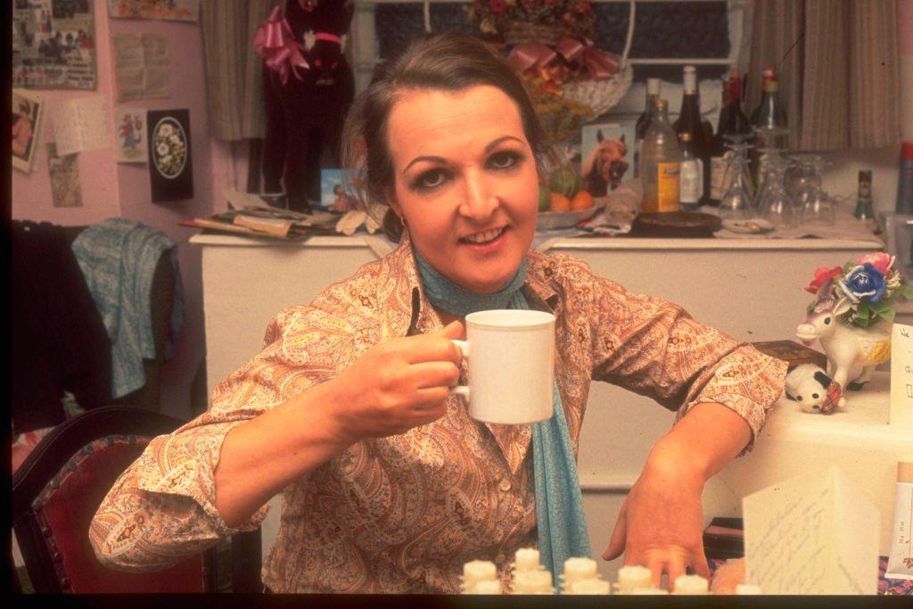 Penelope Keith photographed in her dressing room in 1977. She is drinking from a mug
