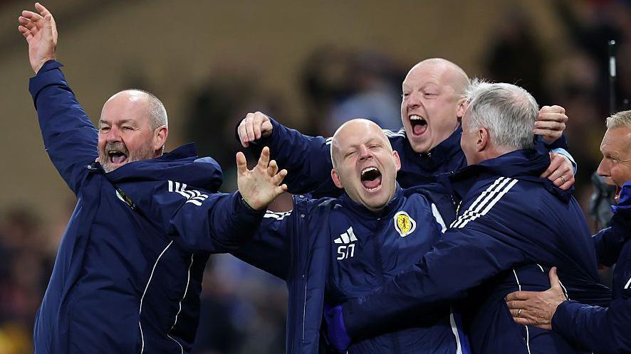 Steve Clarke and backroom staff celebrate
