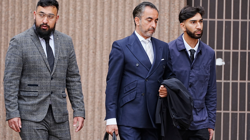 Human Rights lawyer Aamer Anwar (centre) arrives with Muhammed Amaad (left) and Mohammed Fahir Amaaz (right) at Liverpool Crown Court