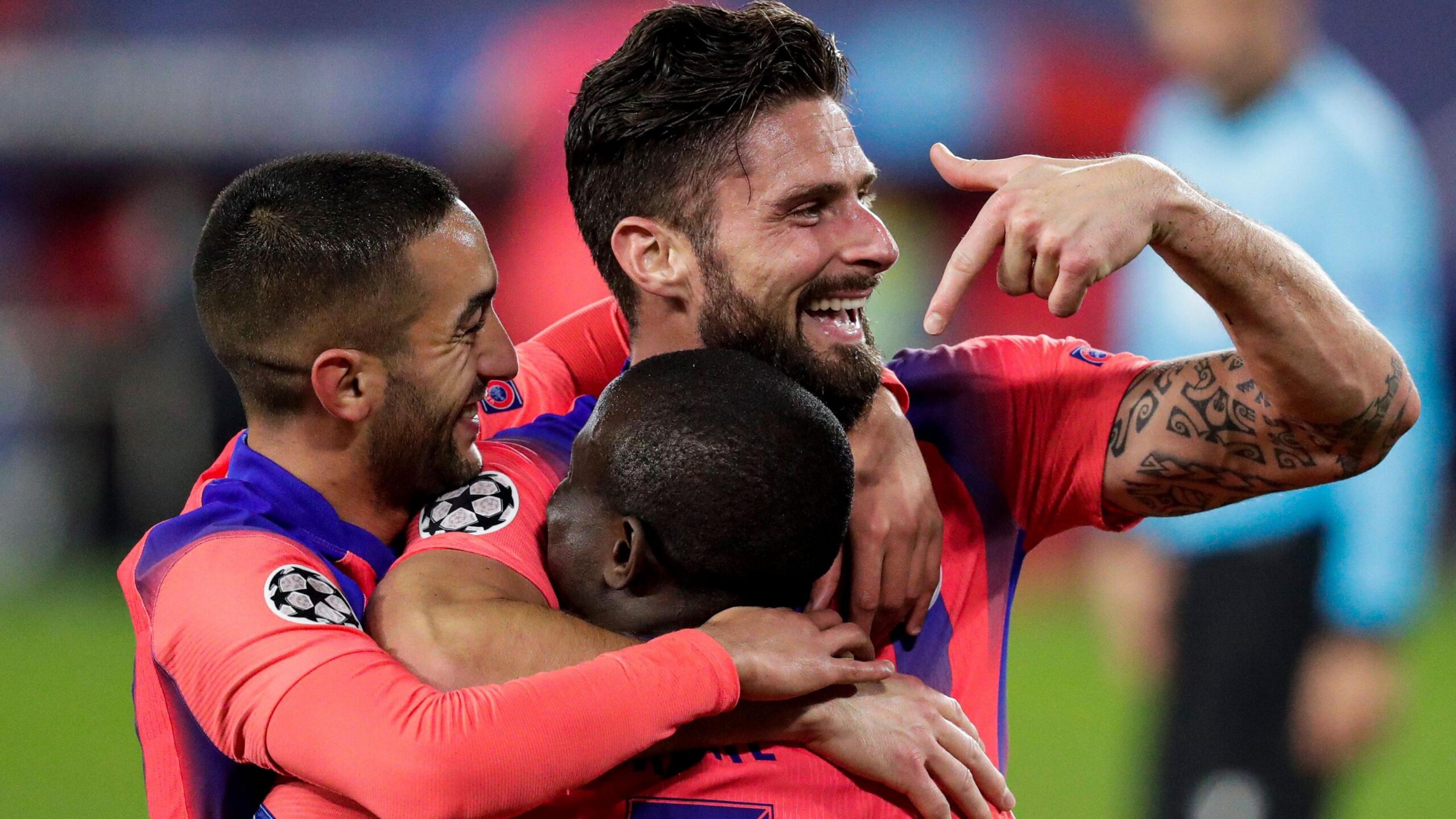 Giroud celebrates with Hakim Ziyech and N'Golo Kante after his third goal against Sevilla in 2020. Kante had provided the cross for Giroud's header that completed his hat-trick, and he scored all four of Chelsea's goals that night