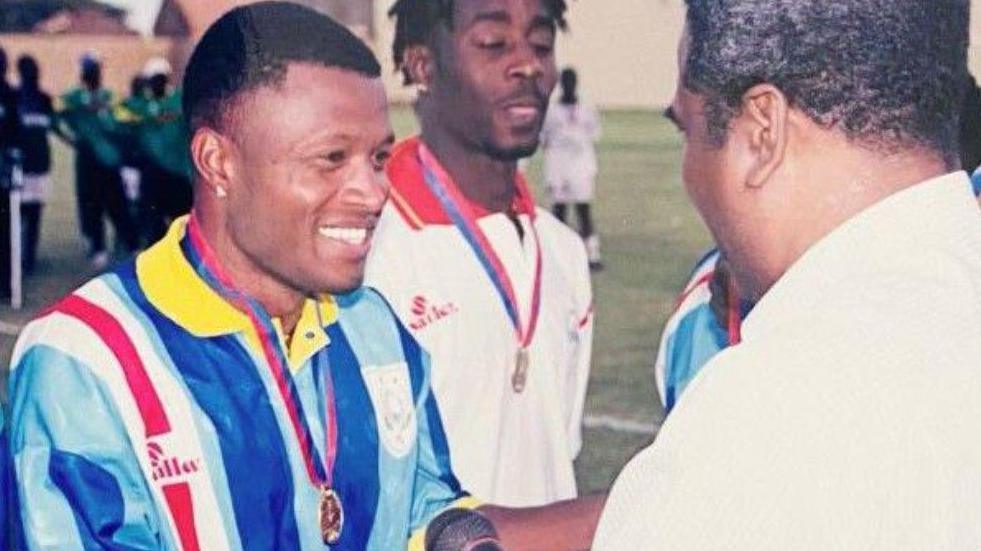 Anselmo 'Jair' Ribeiro receives his winners' medal after helping Cape Verde win the Amilcar Cabral Cup in 2000
