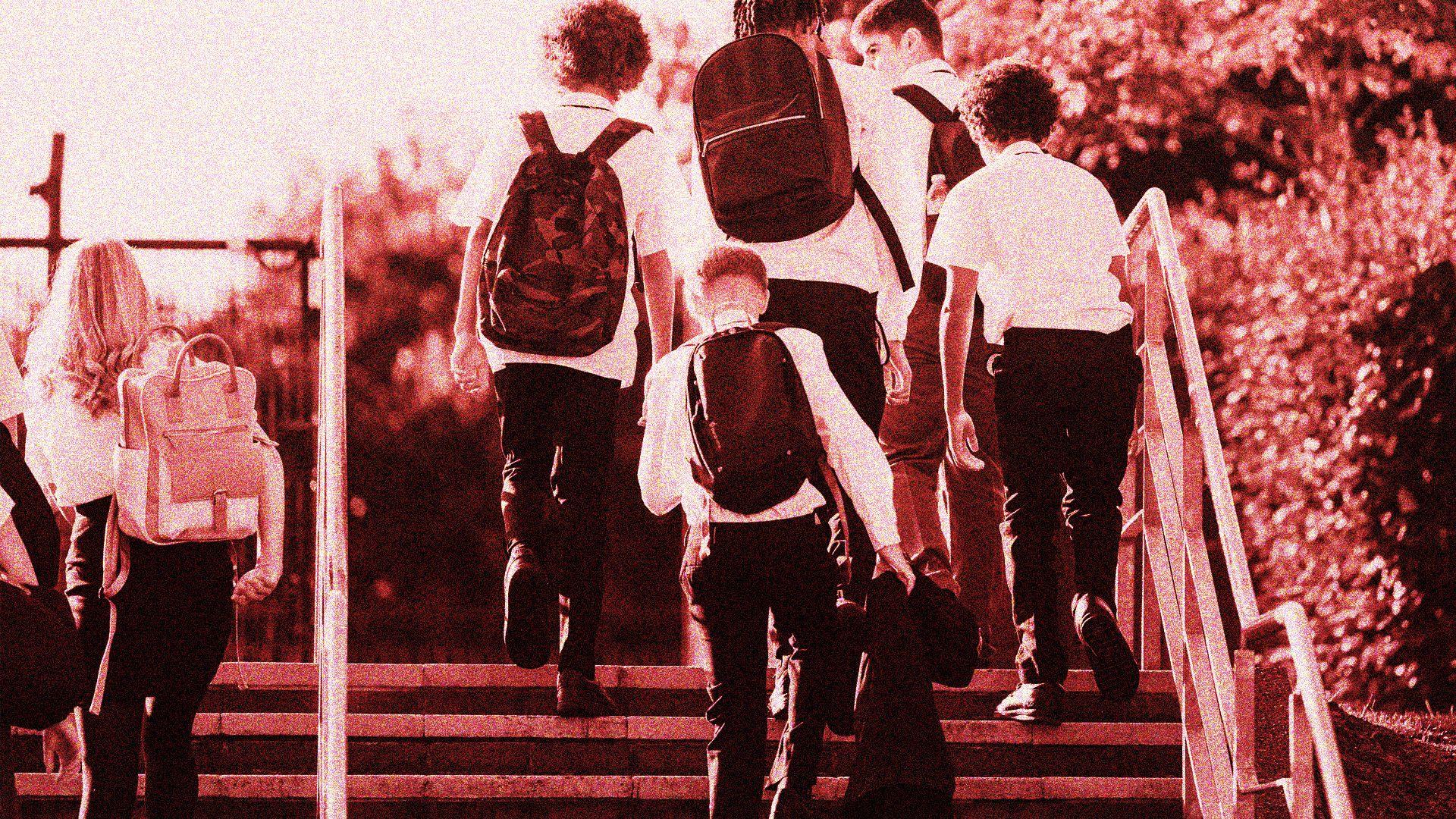 Photo of six teenage schoolchildren walking up steps. They are wearing dark trousers and skirts, with white shirts. Some are carrying rucksacks on their backs.