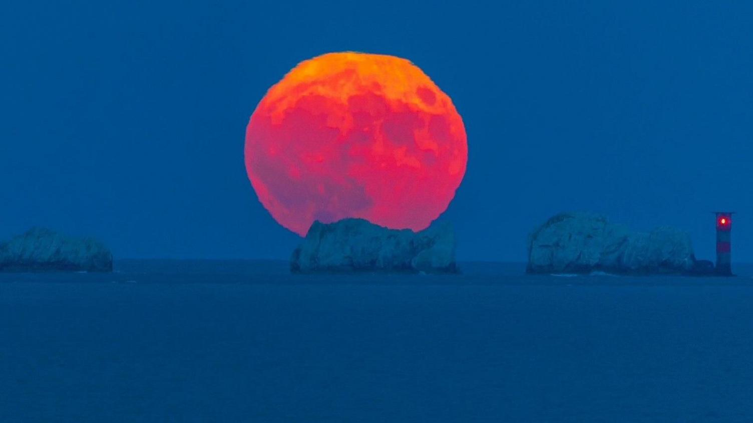 The full Strawberry moon rising over the Needles