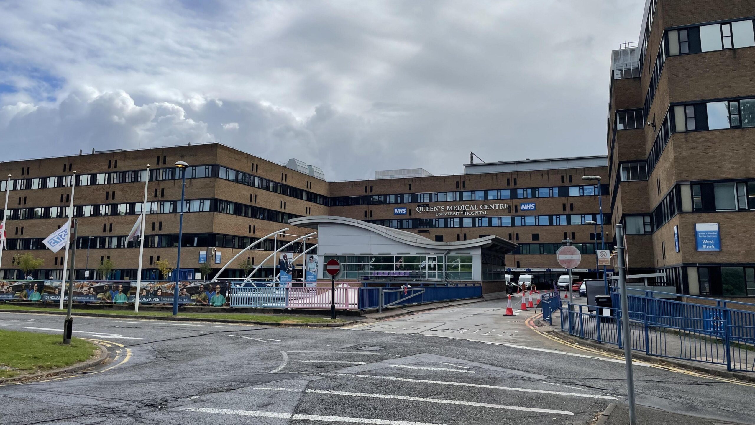 Exterior shot of the Queens Medical Centre - a large four storey building consisting of square blocks