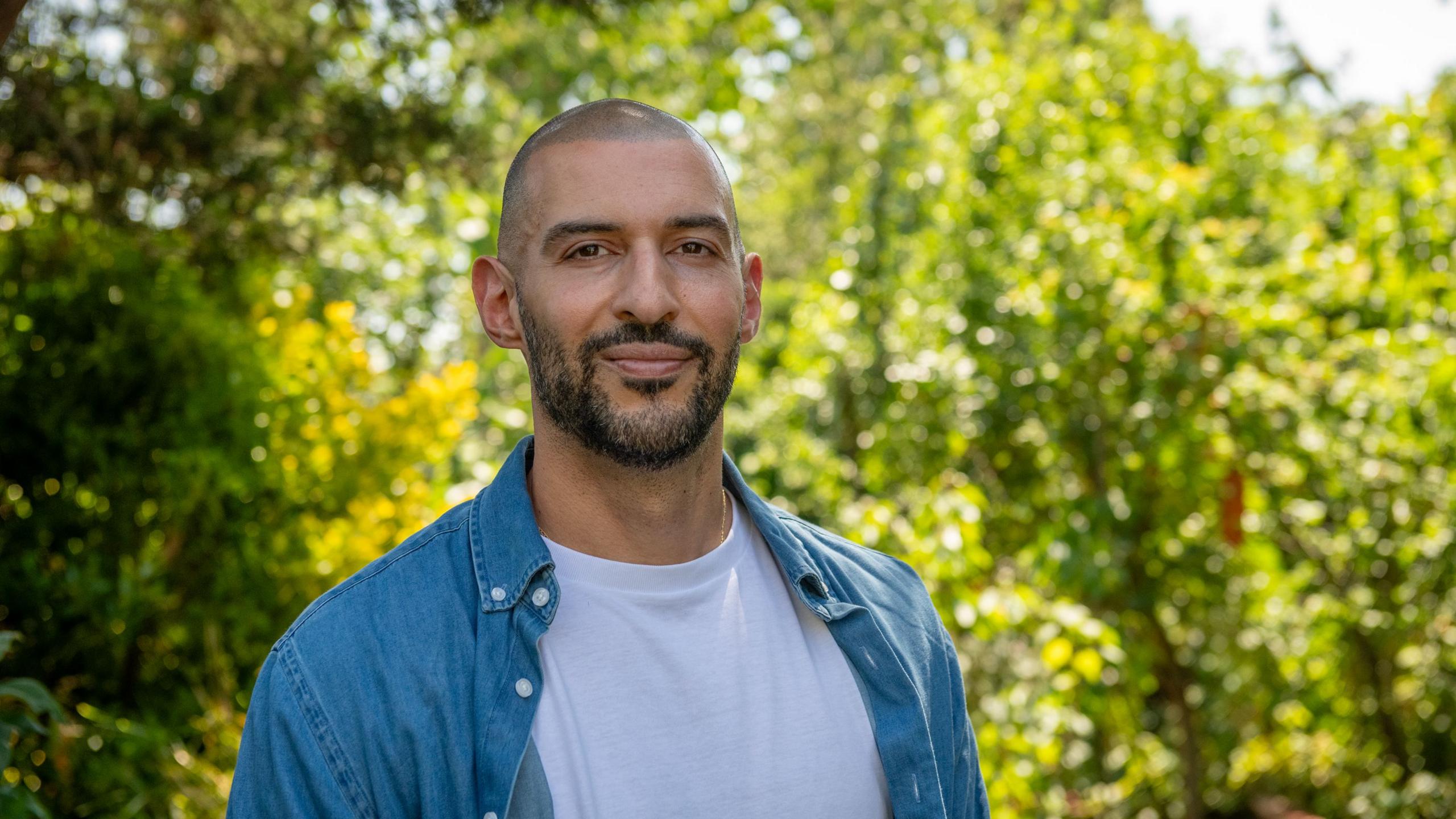 Marios, standing in front of trees