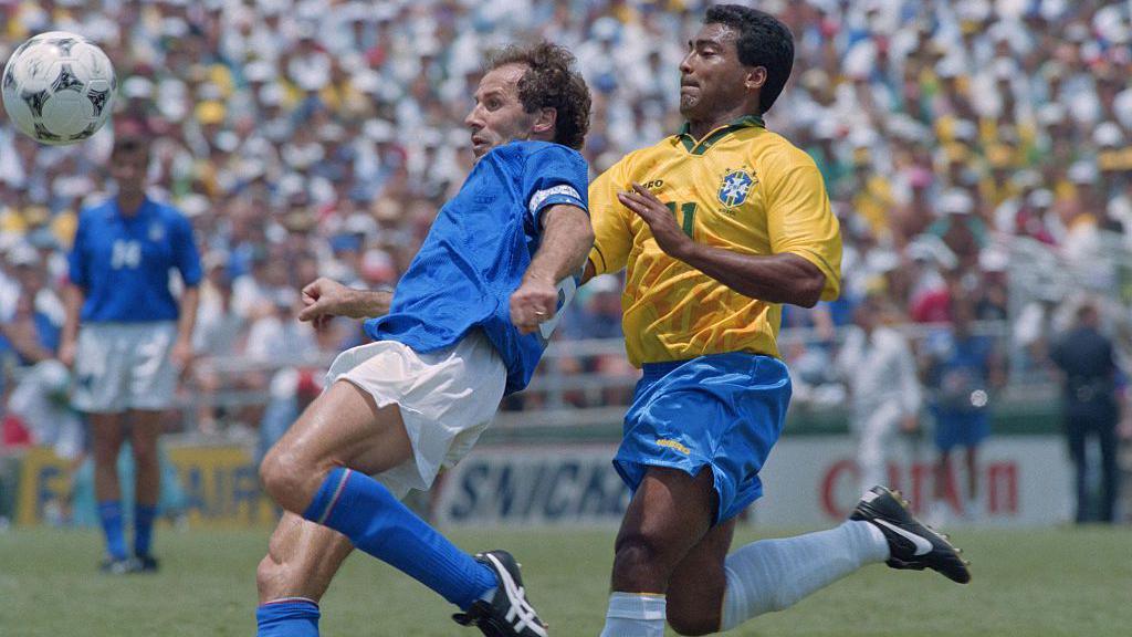 Franco Baresi clears the ball under pressure from Brazil's Romario in the 1994 World Cup final