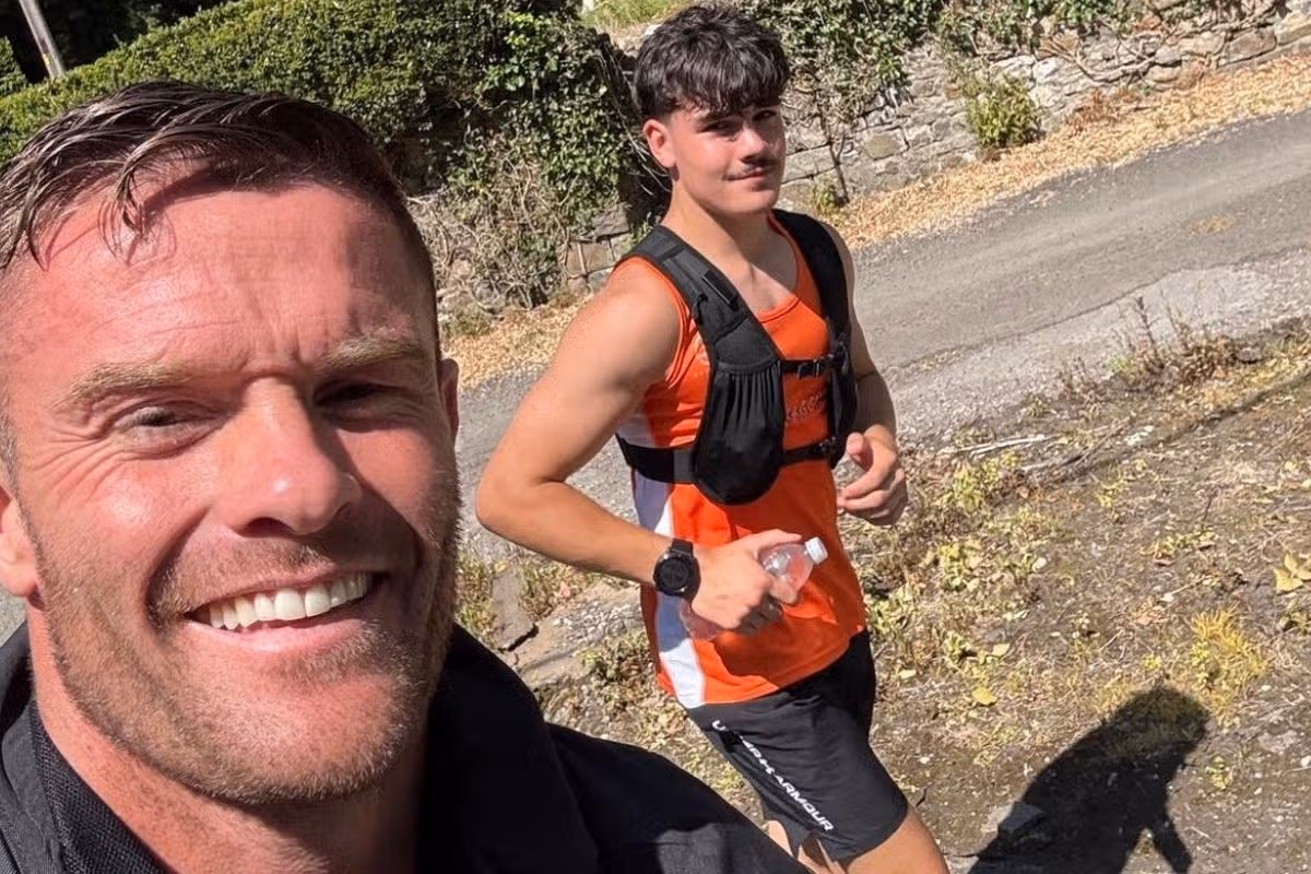Man running alongside son