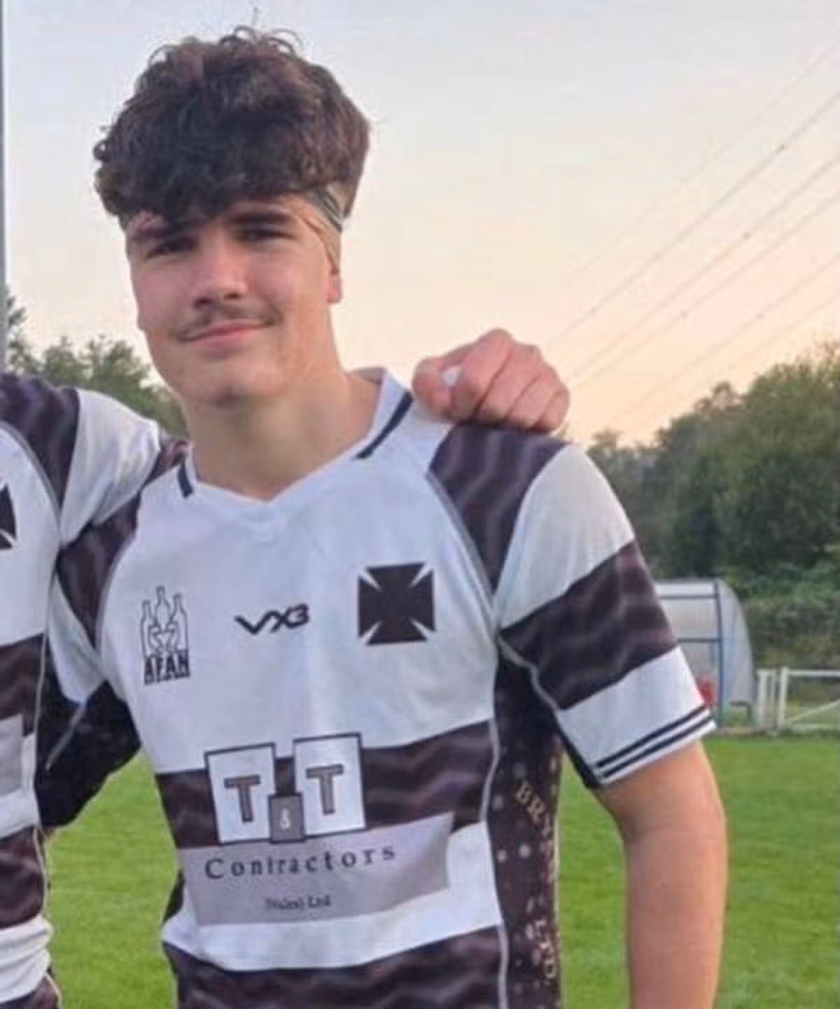 Young man in rugby kit