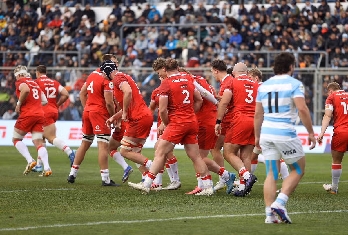 Rhys Carre of Wales celebrates scoring a try with team mates