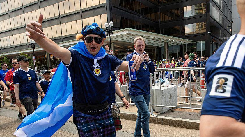 Members of the Tartan Army make their way to South Station to board trains to Boston Stadium to watch the upcoming World Cup match between Scotland and Morocco in Boston, Massachusetts, on June 19, 2026.