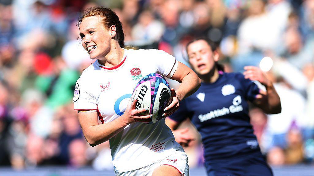 Mia Venner smiles as she prepares to score a try for England against Scotland