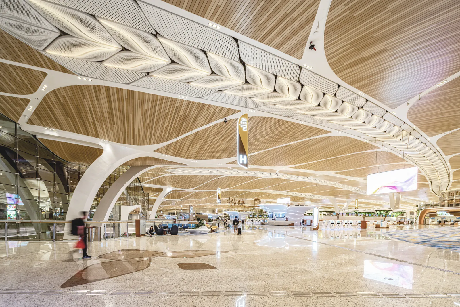 Image may contain Airport Terminal Architecture Building Furniture Indoors Lounge Person and Airport Terminal