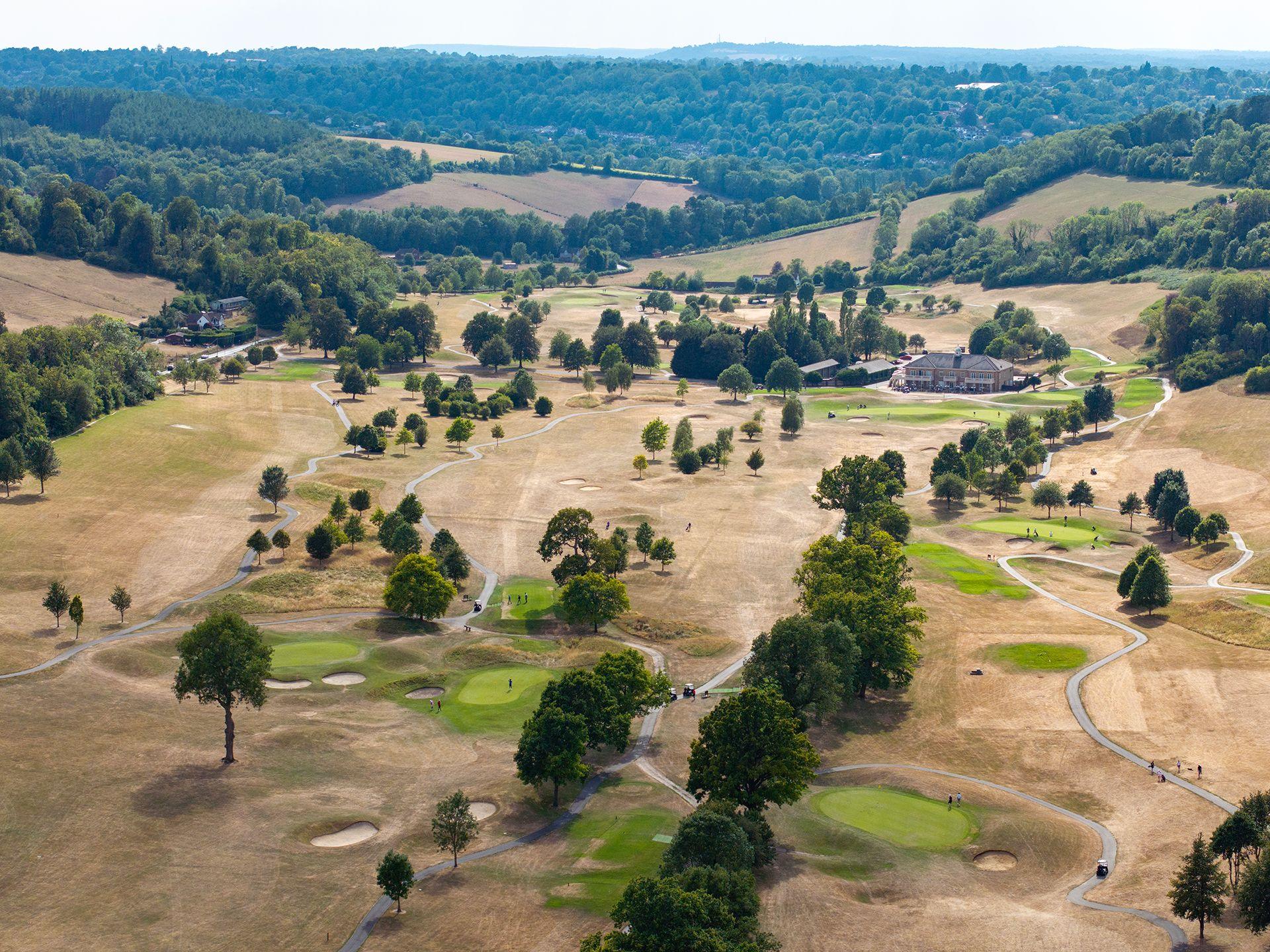 Golfers on the green at Woldingham Golf Club on July 25, 2026 in Woldingham, United Kingdom.