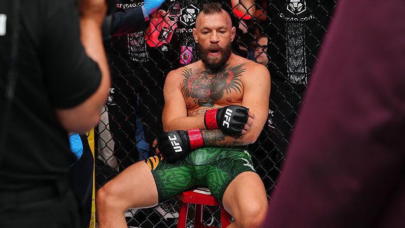 Conor McGregor sits on a stool