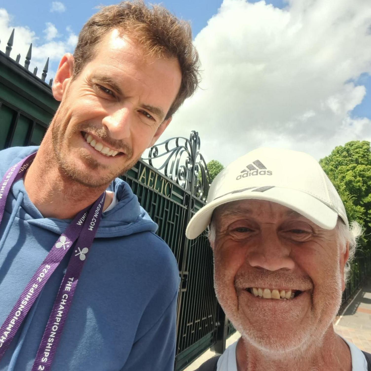 Geoff is taking a selfie with Andy Murary at Wimbledon