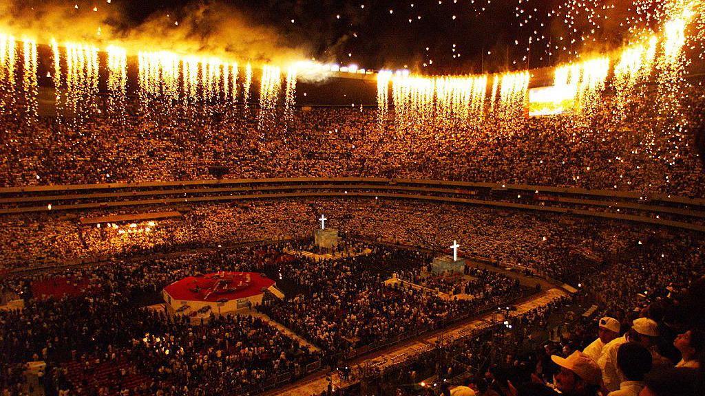Fireworks shoot from the roof of Azteca Stadium in Mexico City at the end of a Catholic mass delivered by Pope John Paul II in 1999
