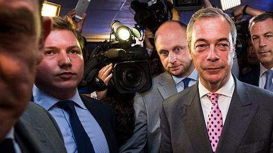Nigel Farage and Cottrell standing side-by-side at a party celebrating the Brexit result in June 2023.