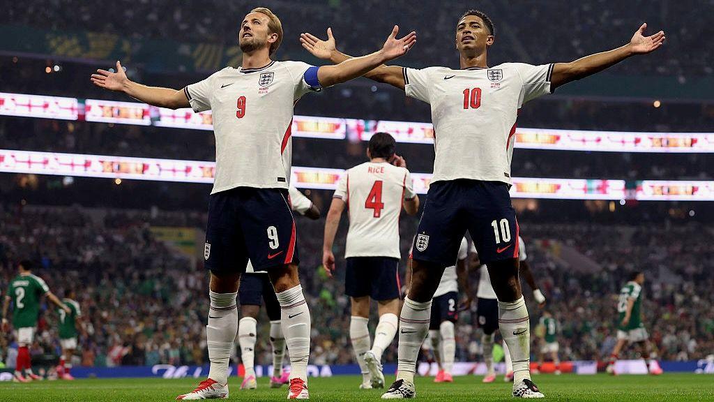 Jude Bellingham celebrates with teammate Harry Kane after scoring his team's first goal during the FIFA World Cup 2026 Round of 16 match between Mexico and England at Estadio Azteca in Mexico City.