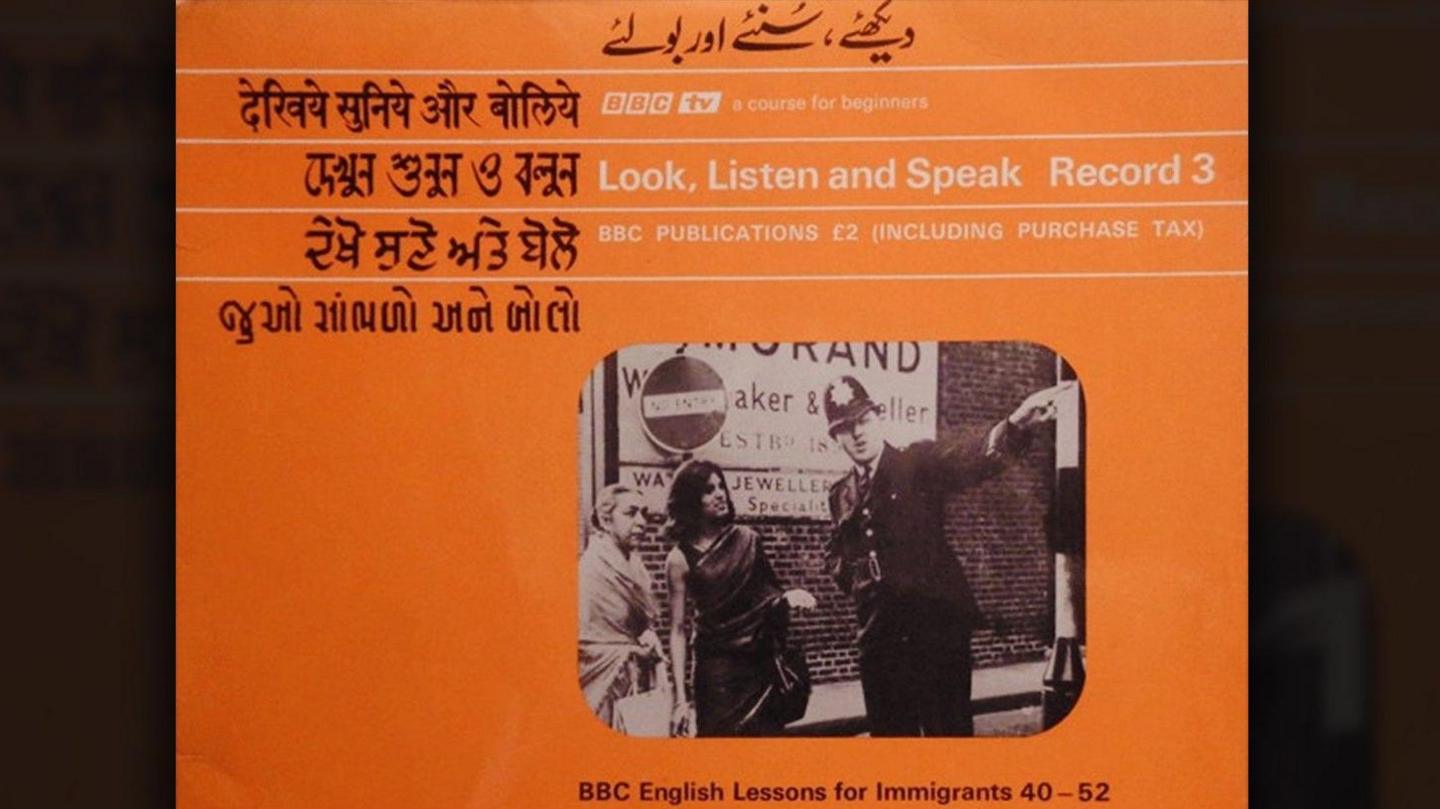 A bright orange LP cover shows the title Look, Listen and Speak in Bengali, English, Gujarati, Hindi, Punjabi and Urdu. This is an English language television course produced by the BBC in the late 1960s, designed to help South Asian immigrants learn basic English, adapt to British culture, and integrate into life in the UK.  In the centre of the cover is a black‑and‑white photo of a police officer talking to two people on a street.