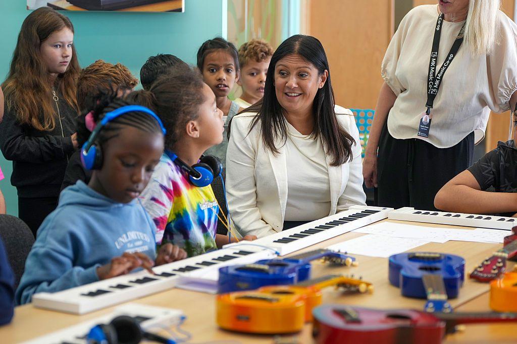 Culture Secretary Lisa Nandy in a classroom full of children playing music